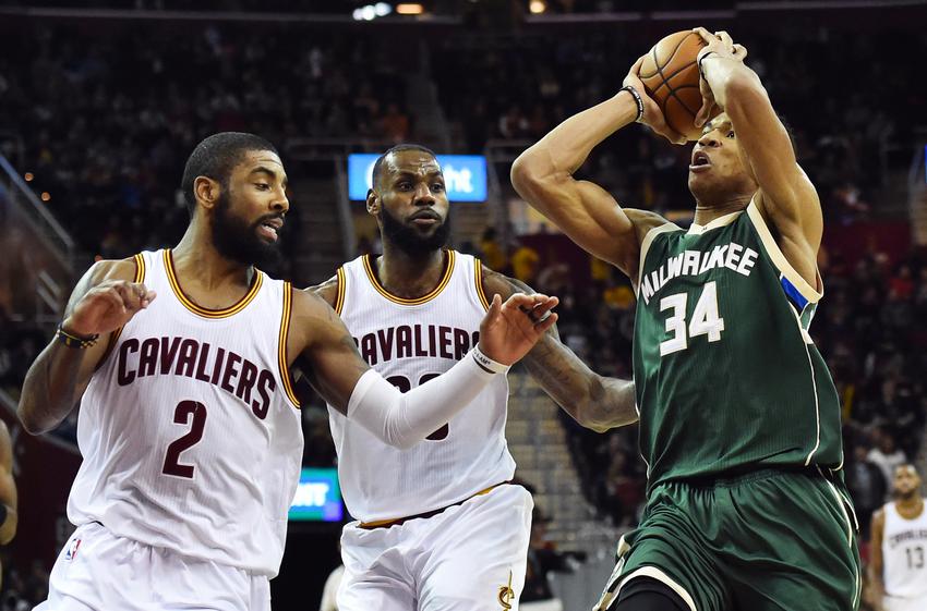 Dec 21, 2016; Cleveland, OH, USA; Milwaukee Bucks forward Giannis Antetokounmpo (34) drives to the basket against Cleveland Cavaliers guard Kyrie Irving (2) and forward LeBron James (23) during the second half at Quicken Loans Arena. The Cavs won 113-102. Mandatory Credit: Ken Blaze-USA TODAY Sports